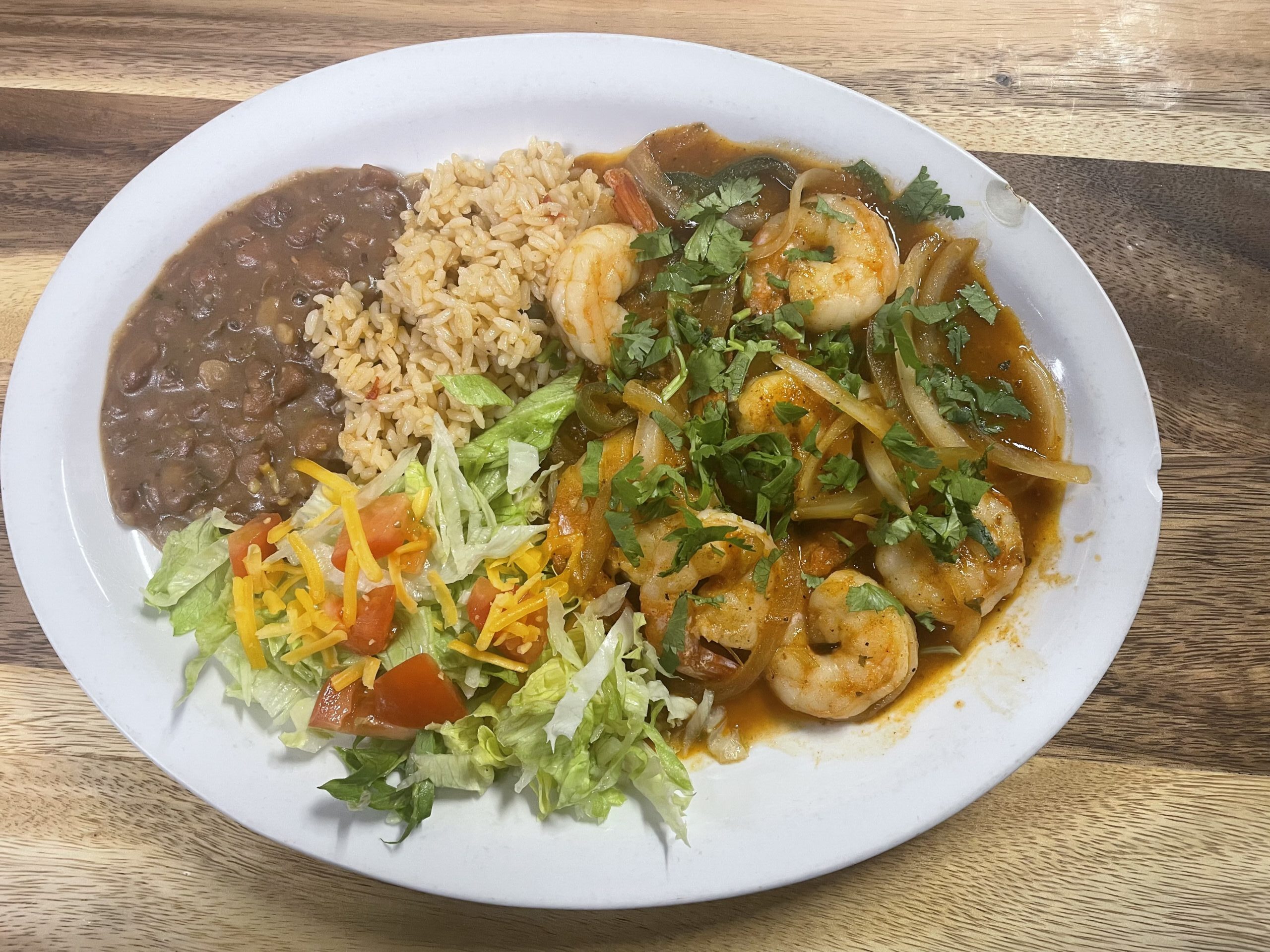 Tex-Mex shrimp entree served with rice, beans, and salad at Anita's Tex-Mex