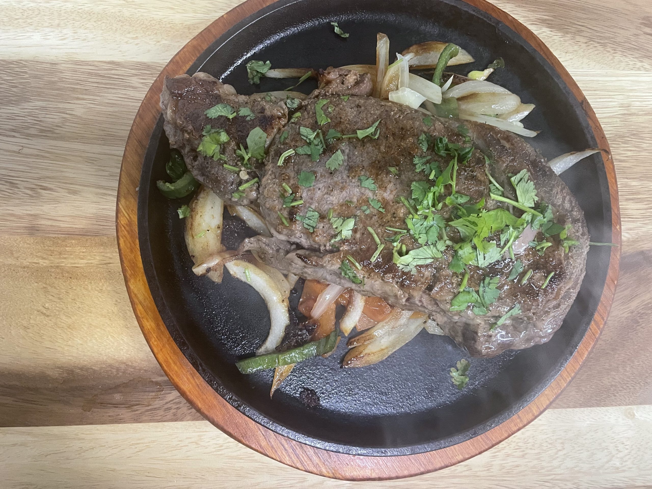 Kevin's Rib-Eye steak served sizzling with onions at Anita's Tex-Mex