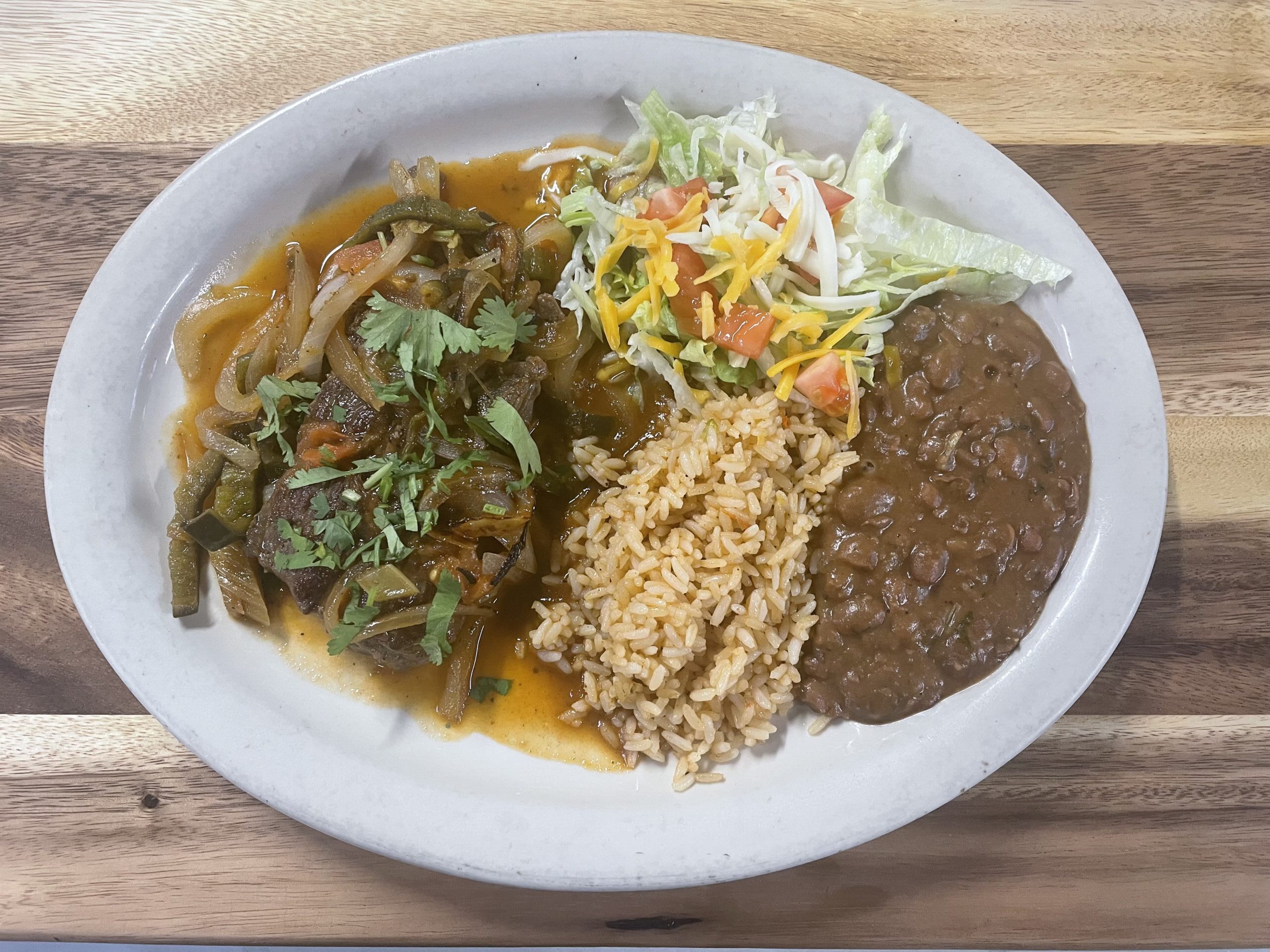 Steak Ranchero served with rice, beans, and salad at Anita's Tex-Mex